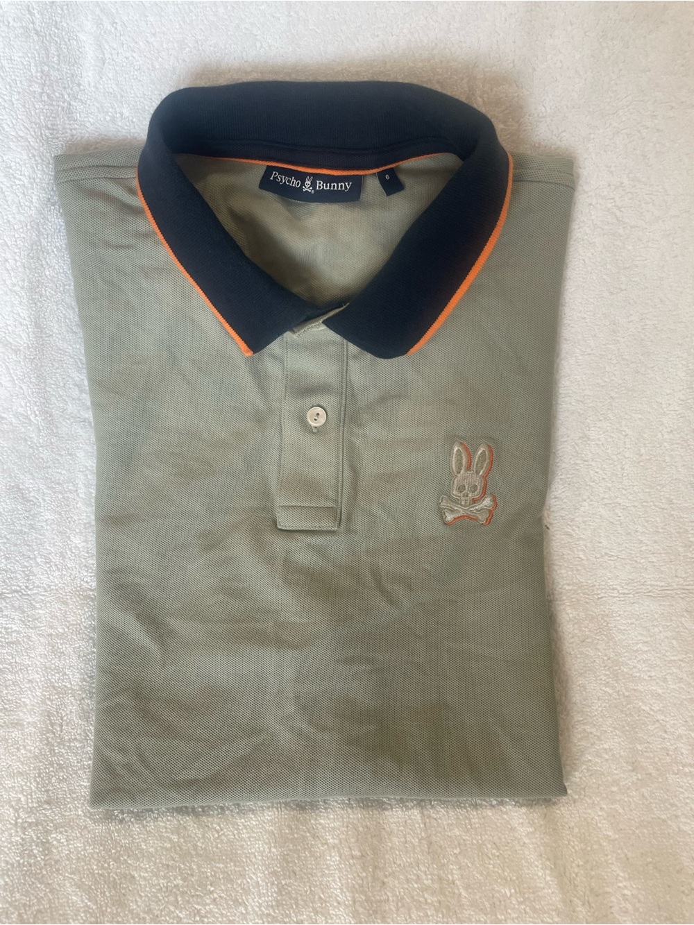 Psycho Bunny Sage Green Polo with Black Collar and Orange Trim